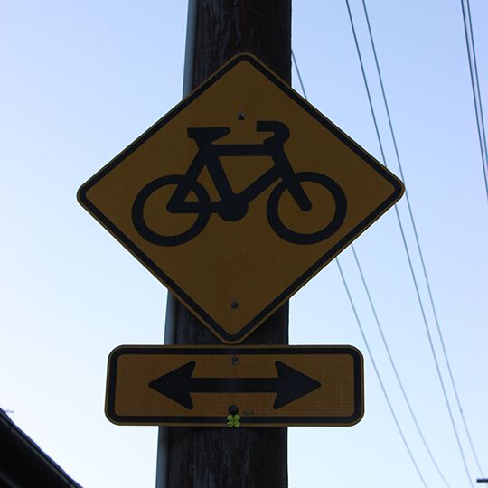  yellow diamond shaped bike sign